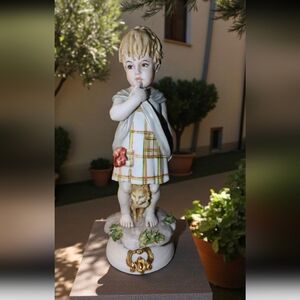 Vintage Benacchio Triade Capodimonte porcelain figurine of a child with a cat. 